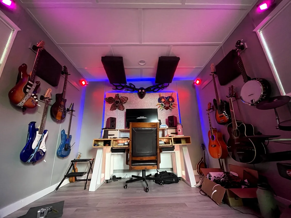 Home studio with guitars, banjos, and Cryptids gear