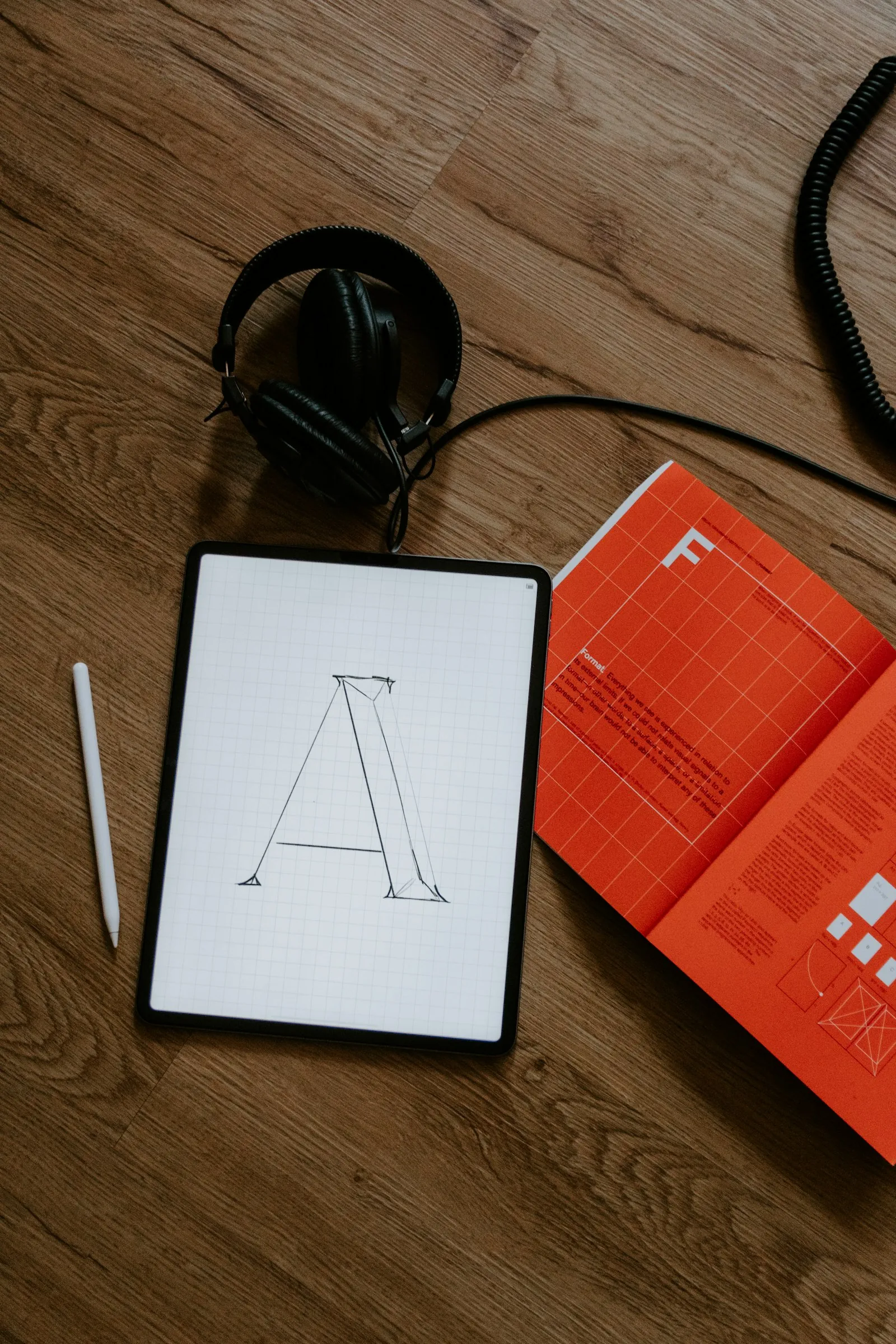 Brand guide and logo mockups on desk