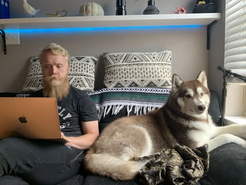 Cody working from home on web projects