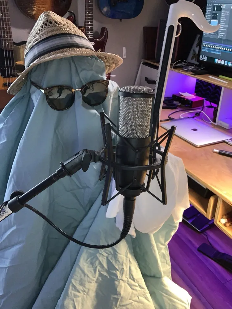 Ghost in a studio hat behind a condenser mic, Reckless Media home studio