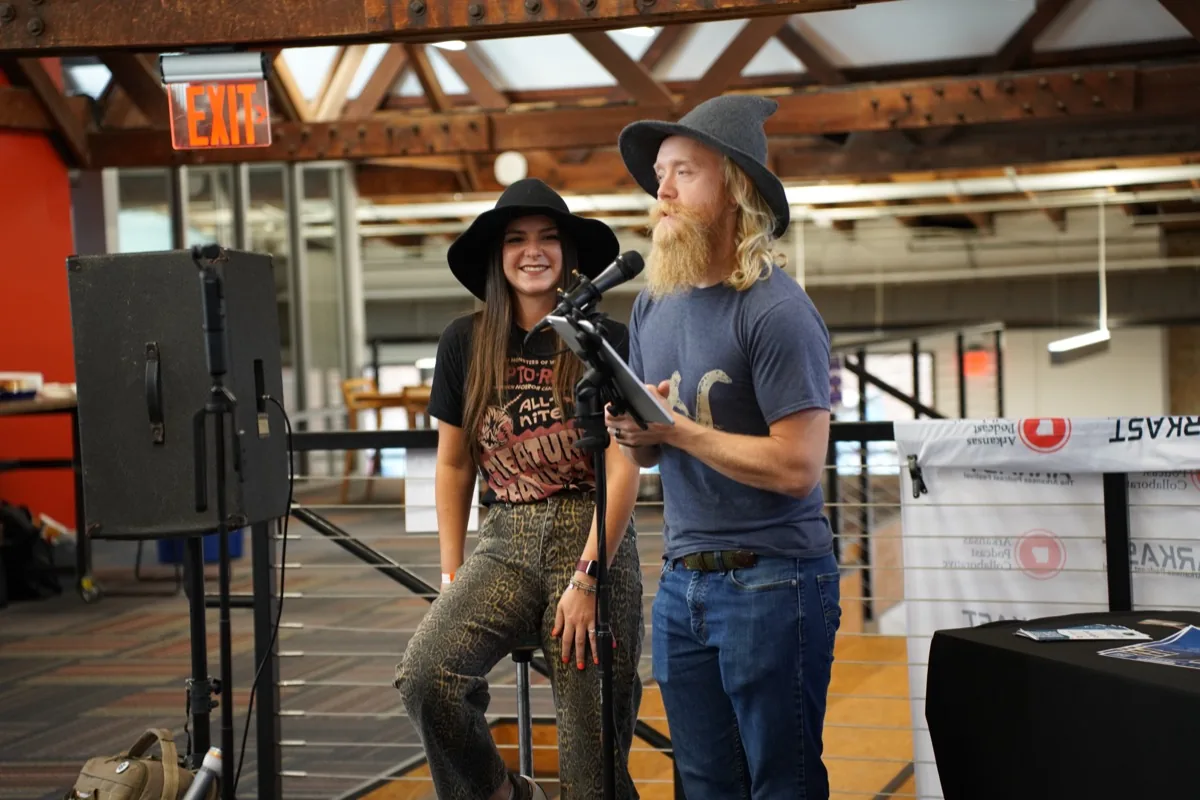 Cody and Elaine speaking at a conference